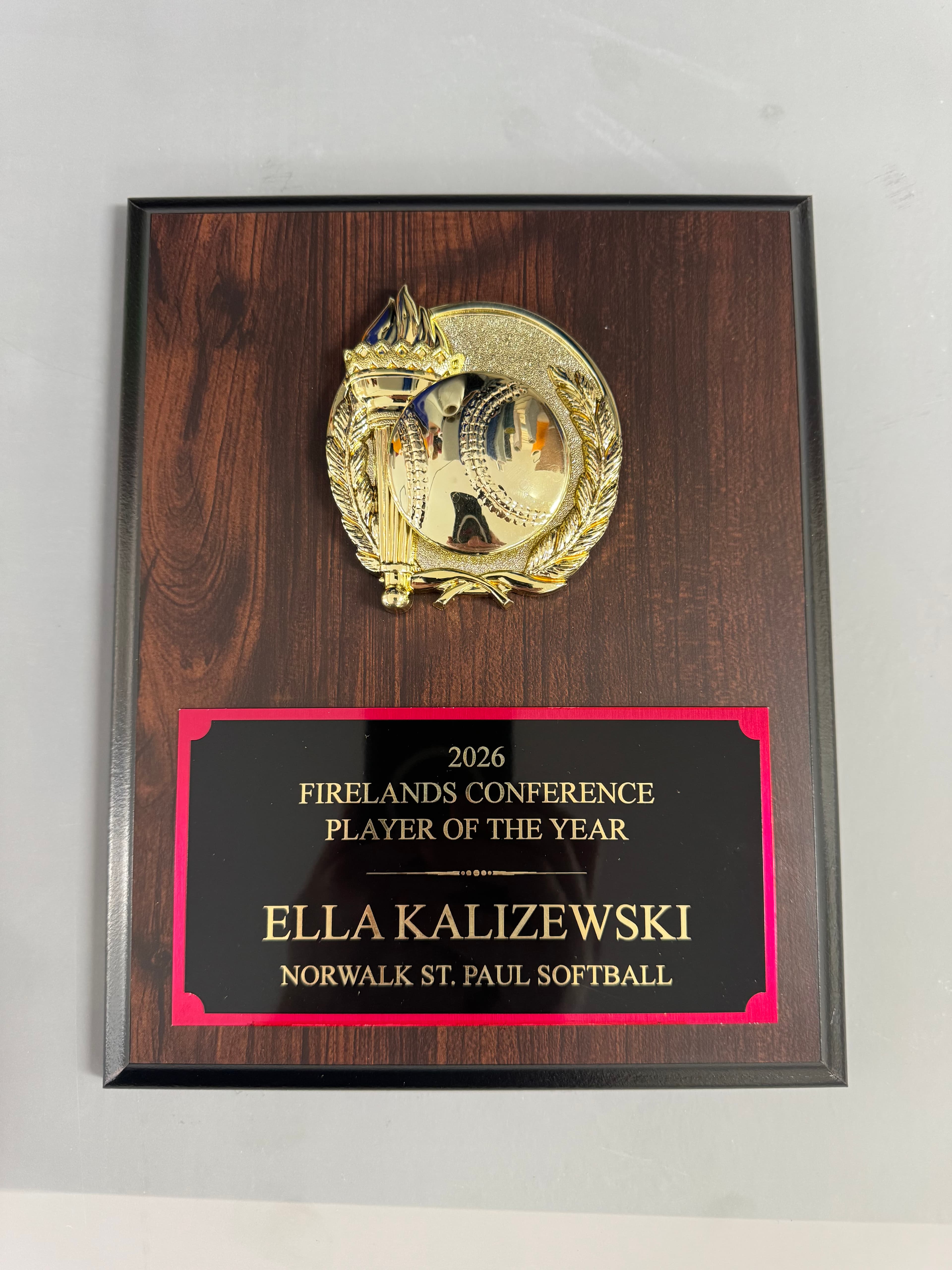 Wooden award plaque for Ella Kalizewski, 2026 Firelands Conference Softball Player of the Year.